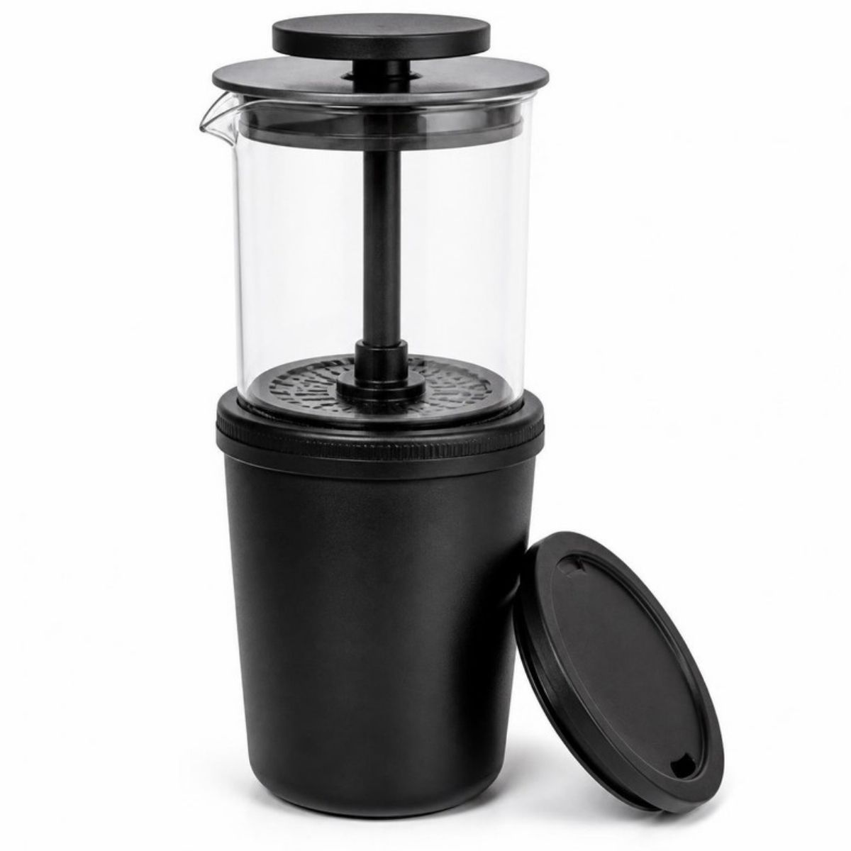Clear coffee press chamber on a black travel cup, with the lid beside it