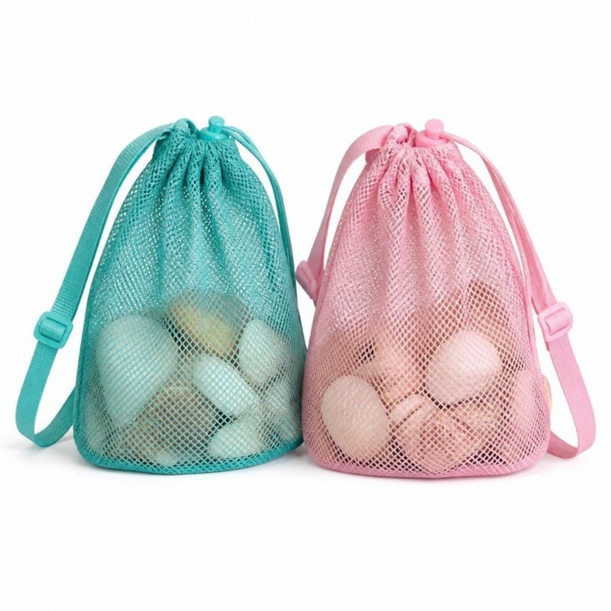 Teal and pink mesh drawstring bags with straps, holding seashells
