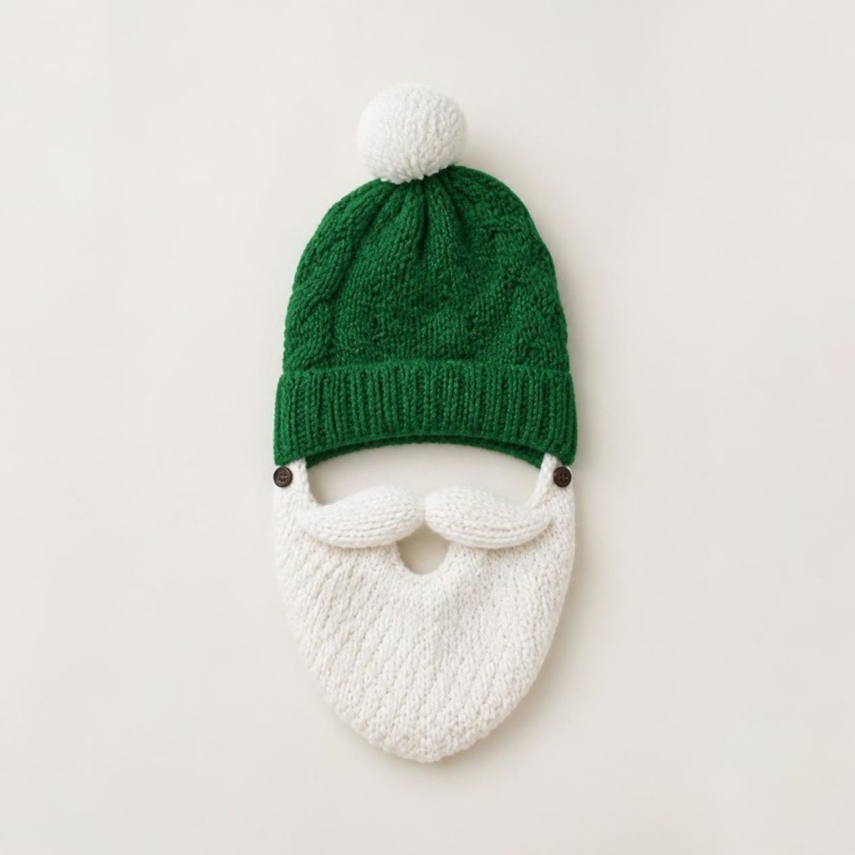 Green knit beanie with a white pom-pom and attached white knit beard