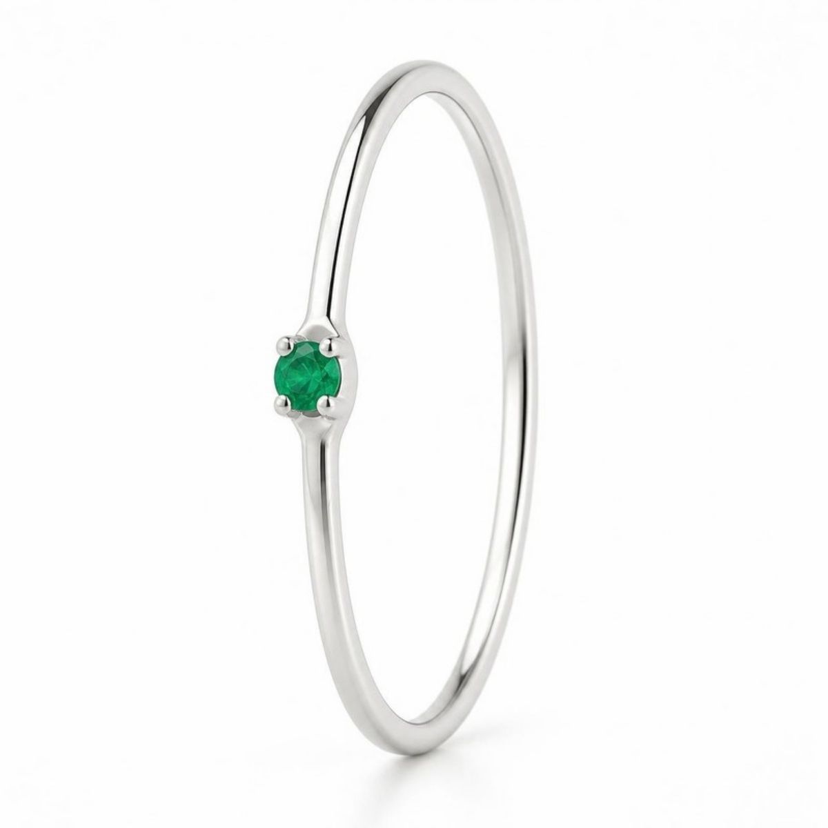 Thin silver ring with a small green birthstone