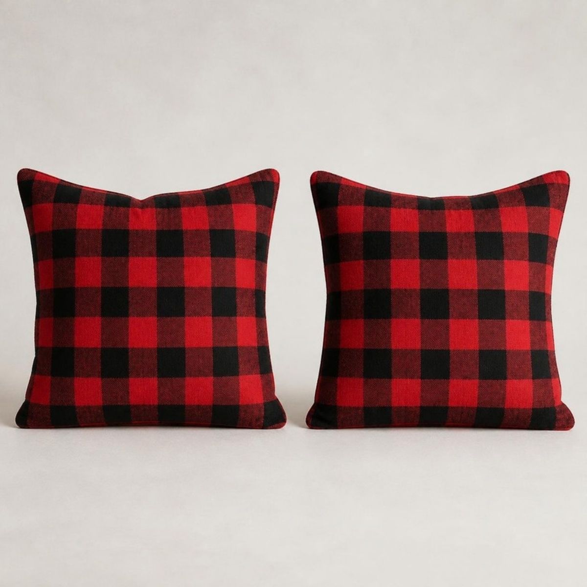 Two red and black buffalo plaid pillow covers