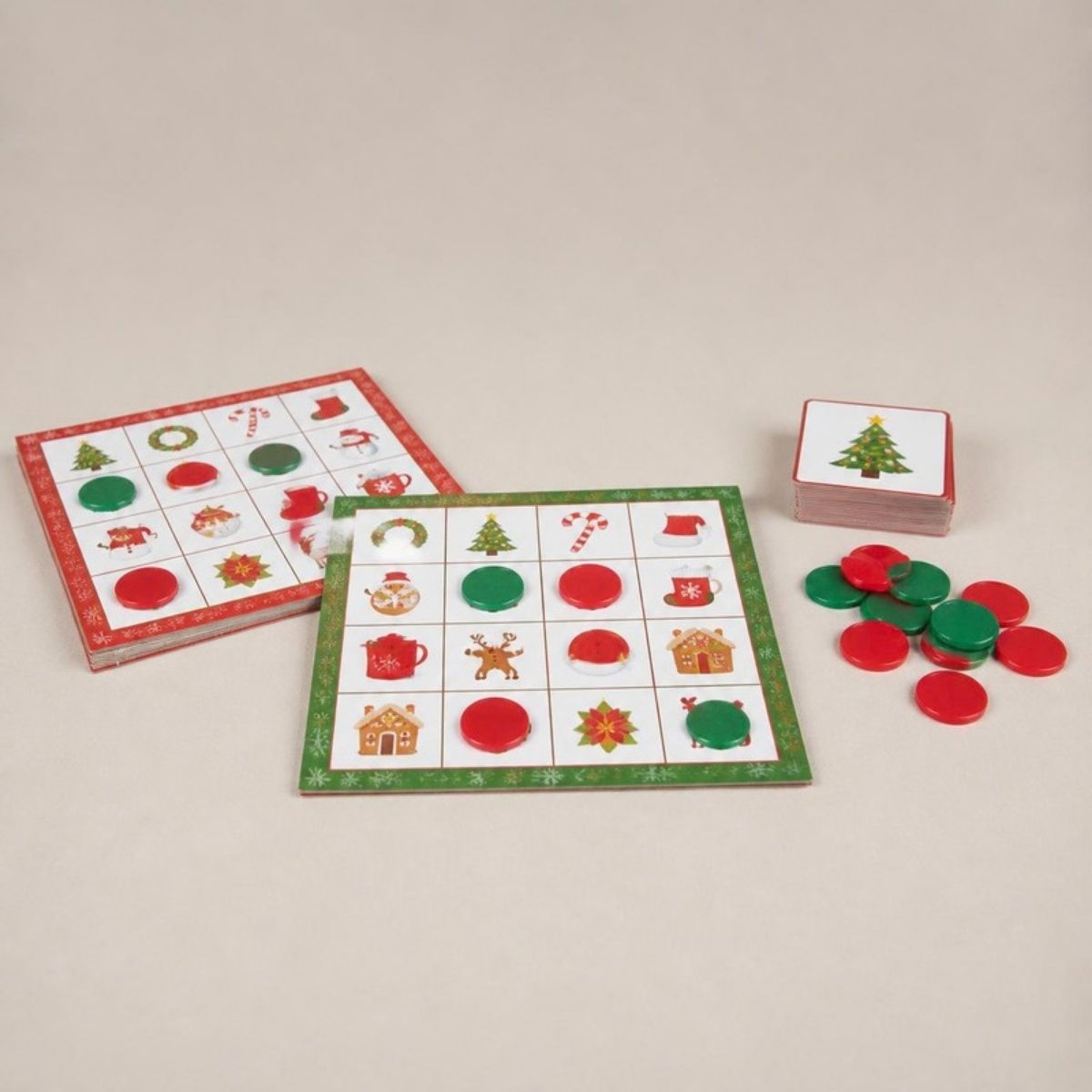 Christmas bingo cards with picture squares, calling cards and red and green chips