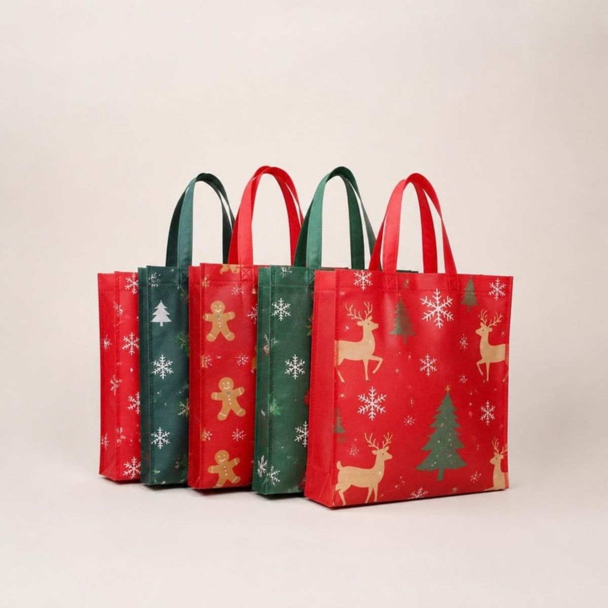 Red and green reusable tote bags printed with reindeer, gingerbread men, trees and snowflakes