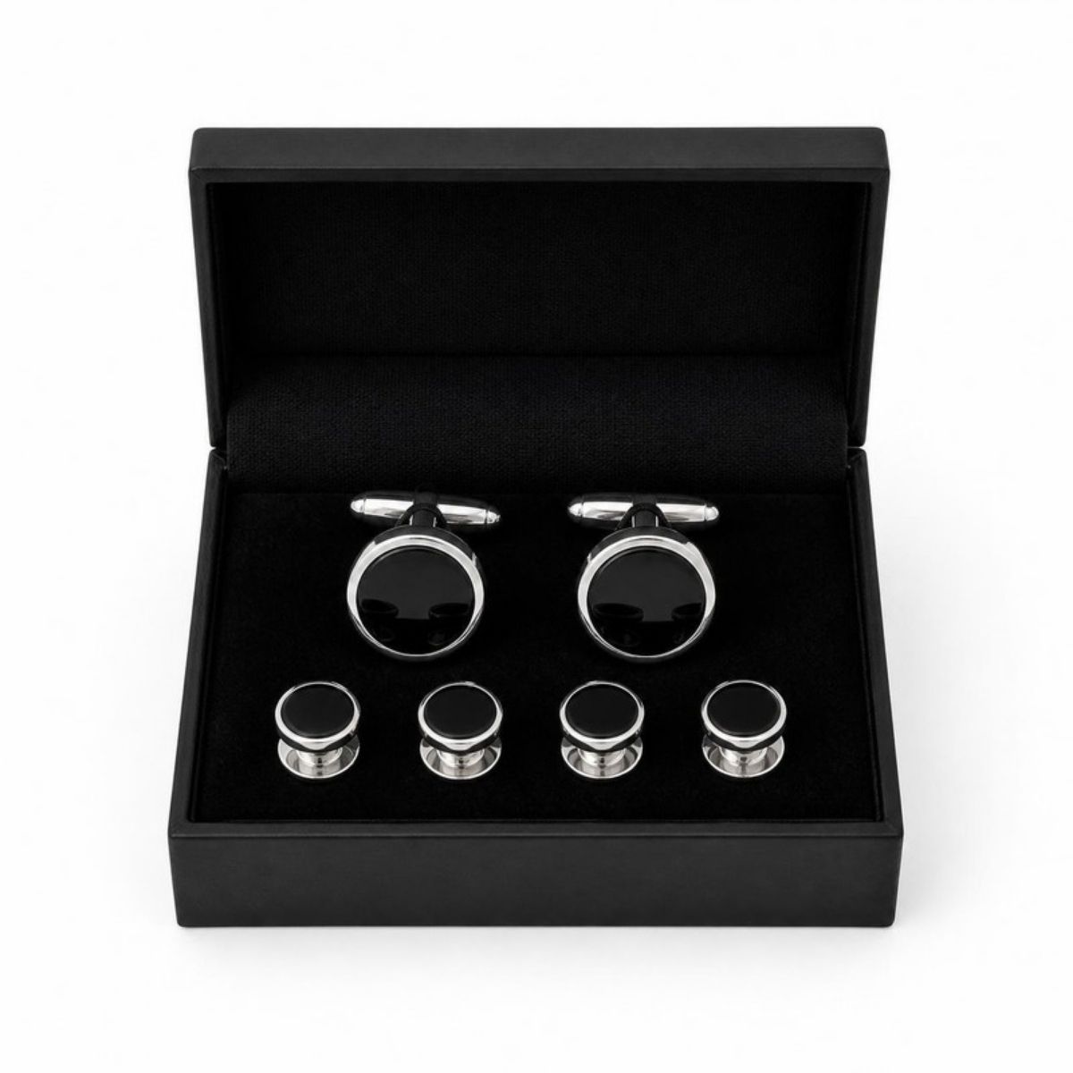 Silver cufflinks and tuxedo studs with black centers in a black gift box