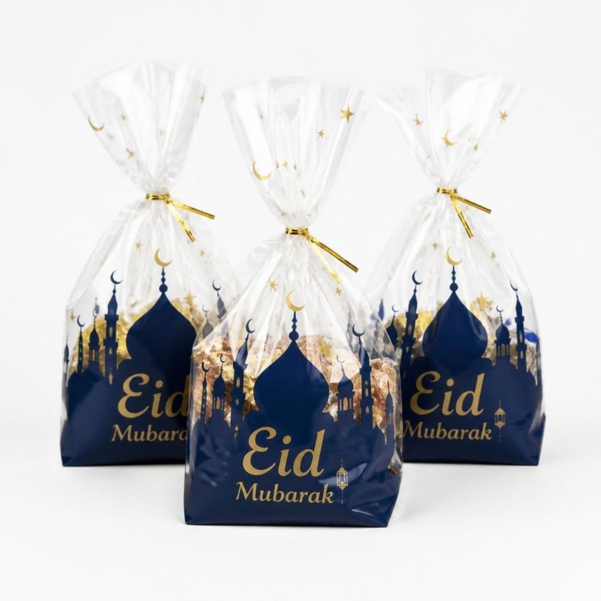 Clear treat bags printed with navy blue mosques and gold "Eid Mubarak"