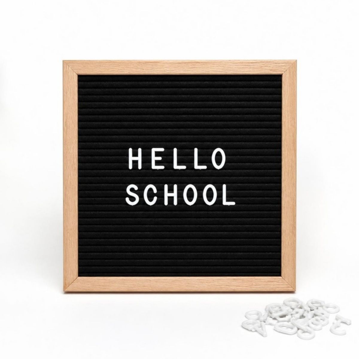 Black felt letter board in a wood frame reading "Hello School"
