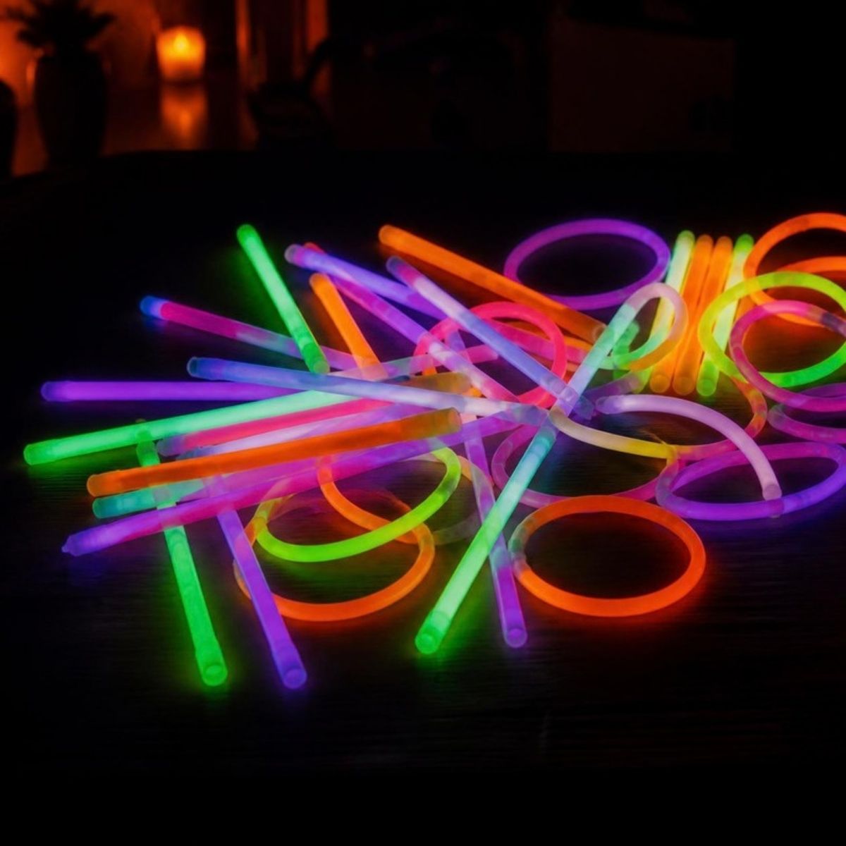 Pile of colorful glowing glow sticks and bracelets