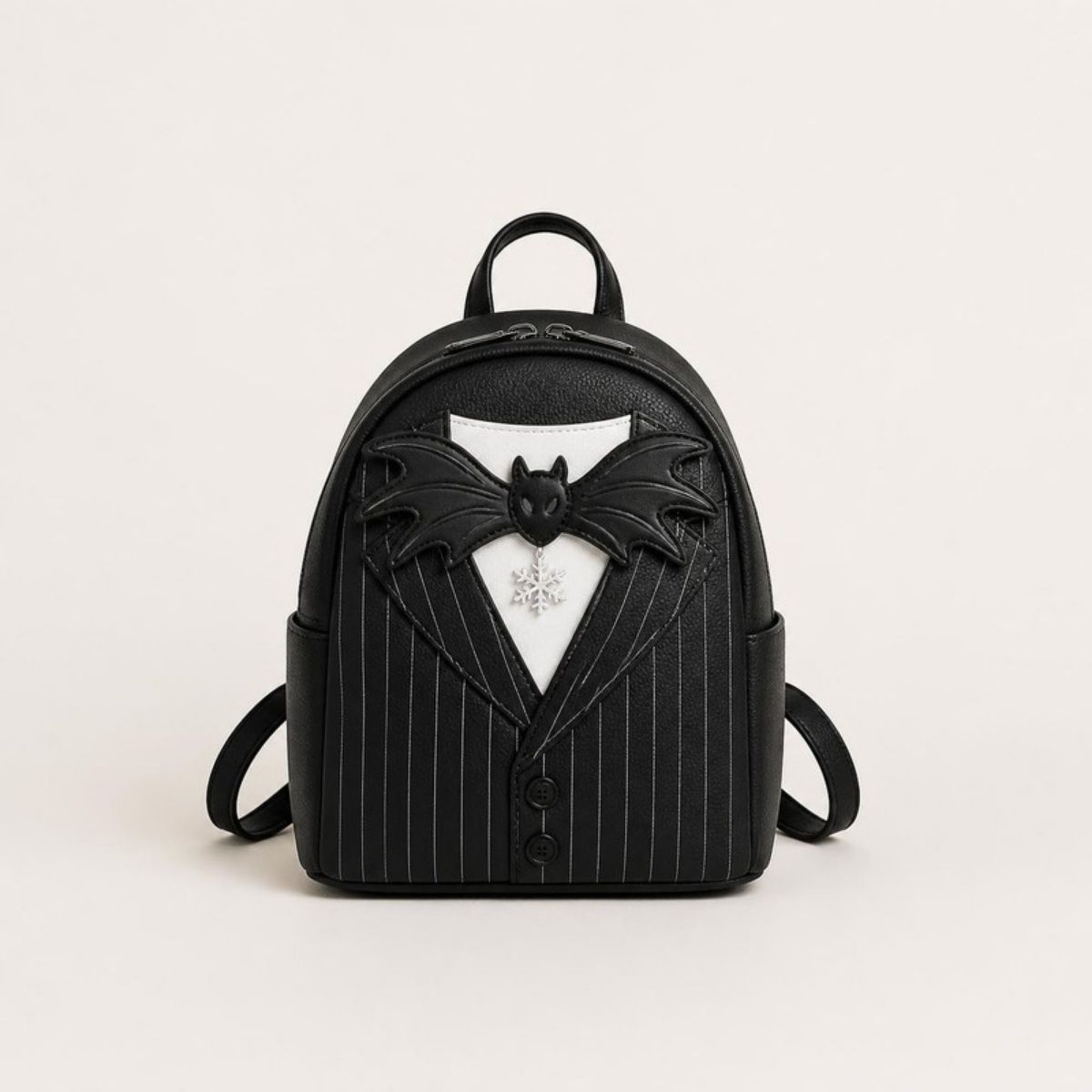 Black pinstripe mini backpack with a bat bow tie and snowflake charm