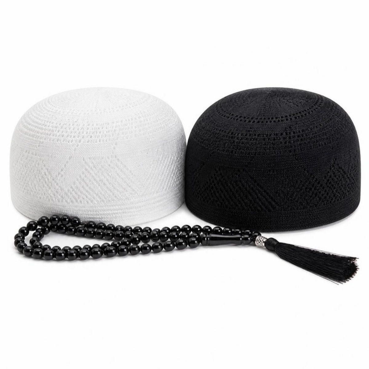 White and black kufi caps with black prayer beads