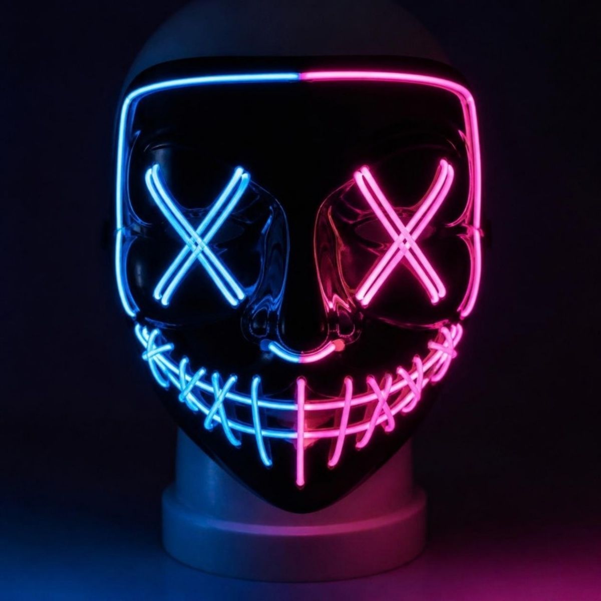 Glowing blue and pink LED costume mask with X eyes and a stitched smile