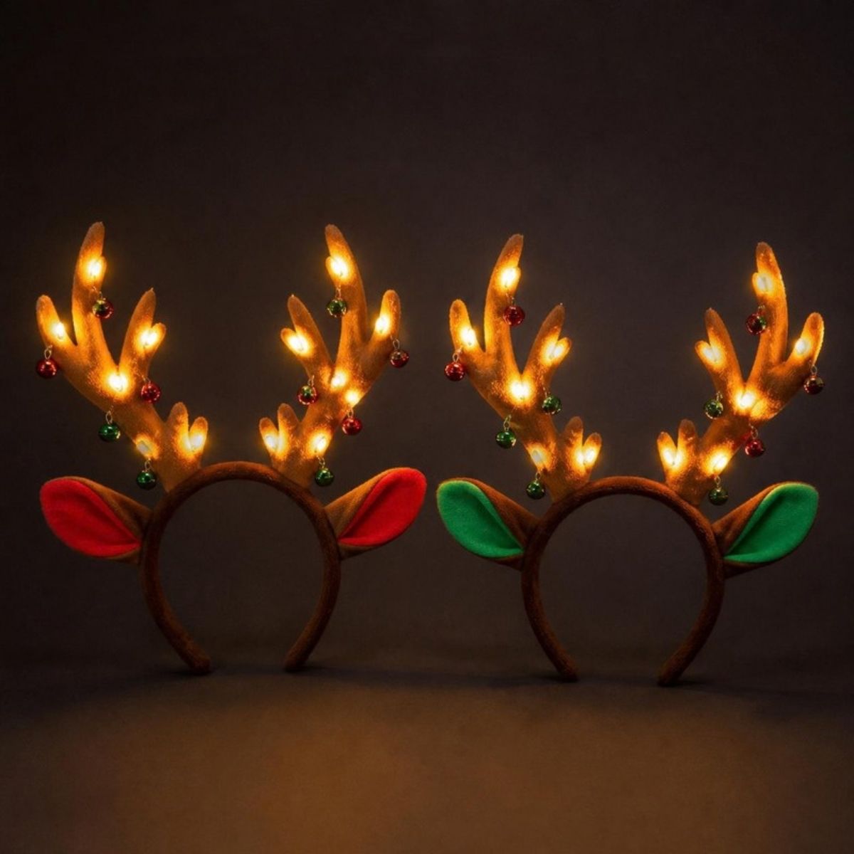 Two light up reindeer antler headbands with jingle bells and red and green ears