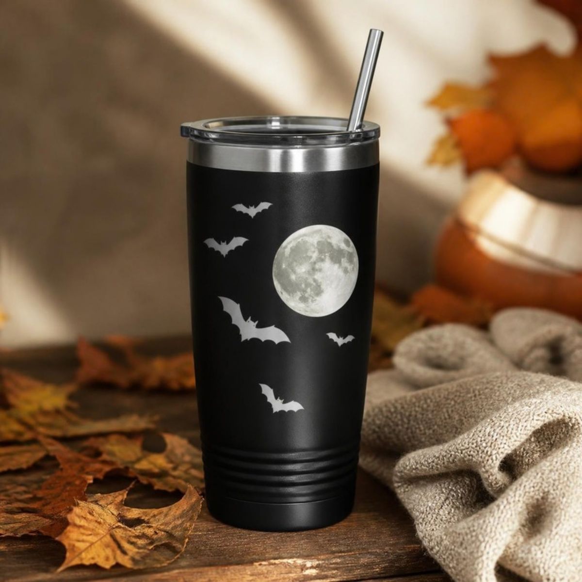 Black insulated tumbler with a full moon and bats design