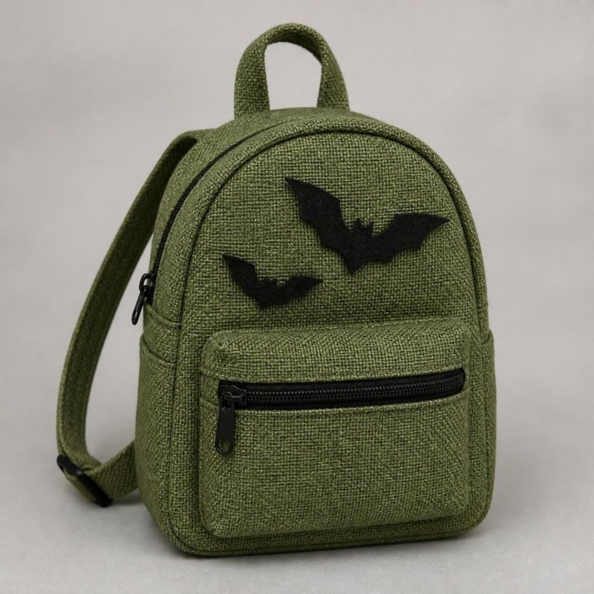 Green mini backpack with black bat appliques