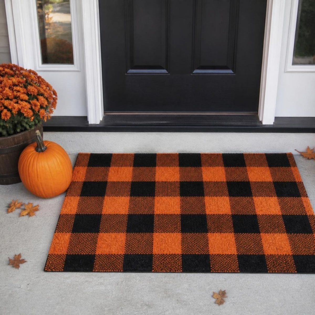 Orange and black buffalo plaid rug at a front door