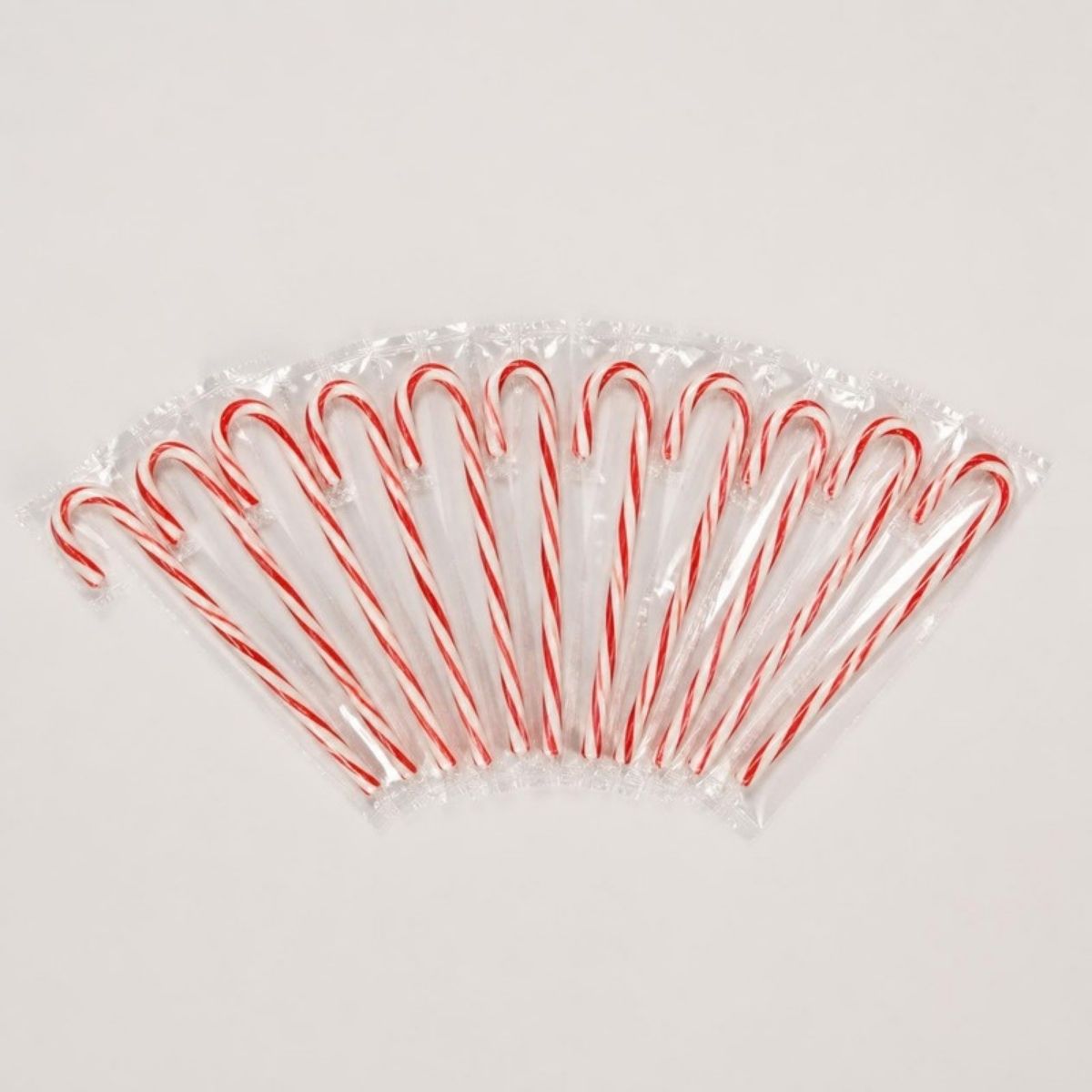 Row of individually wrapped red and white candy canes