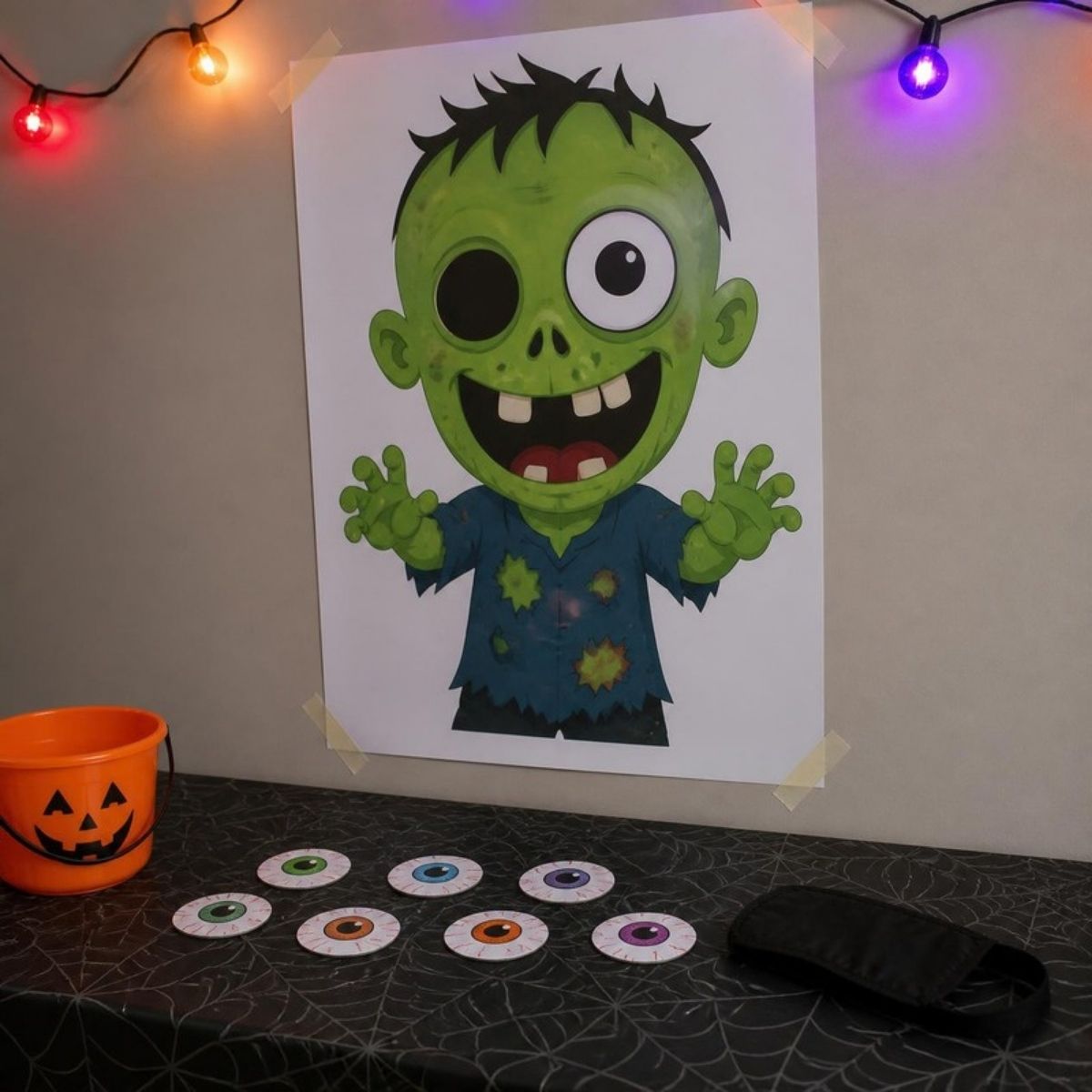 Pin the eyeball on the zombie poster with paper eyeballs and a blindfold