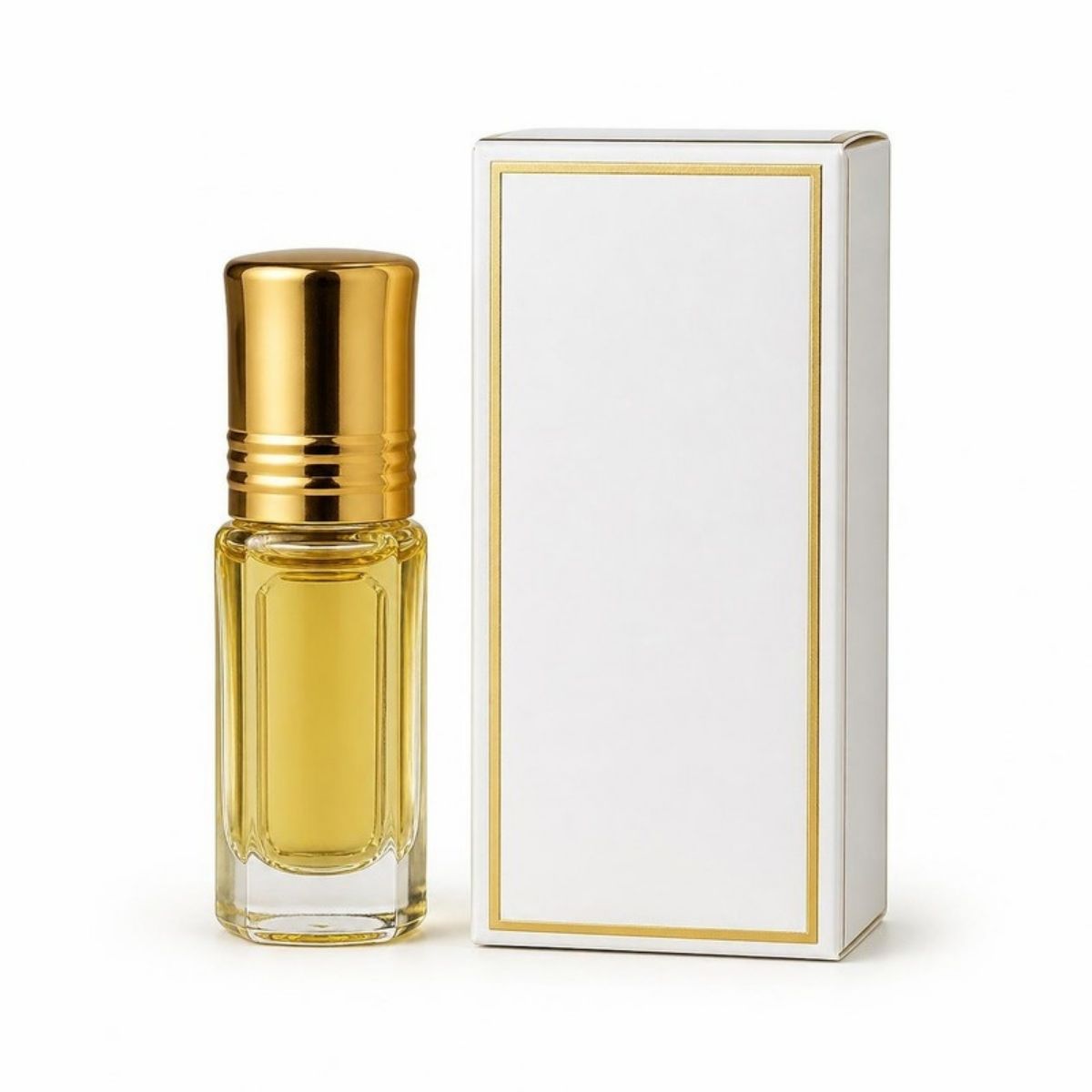 Small gold perfume oil bottle next to a white box