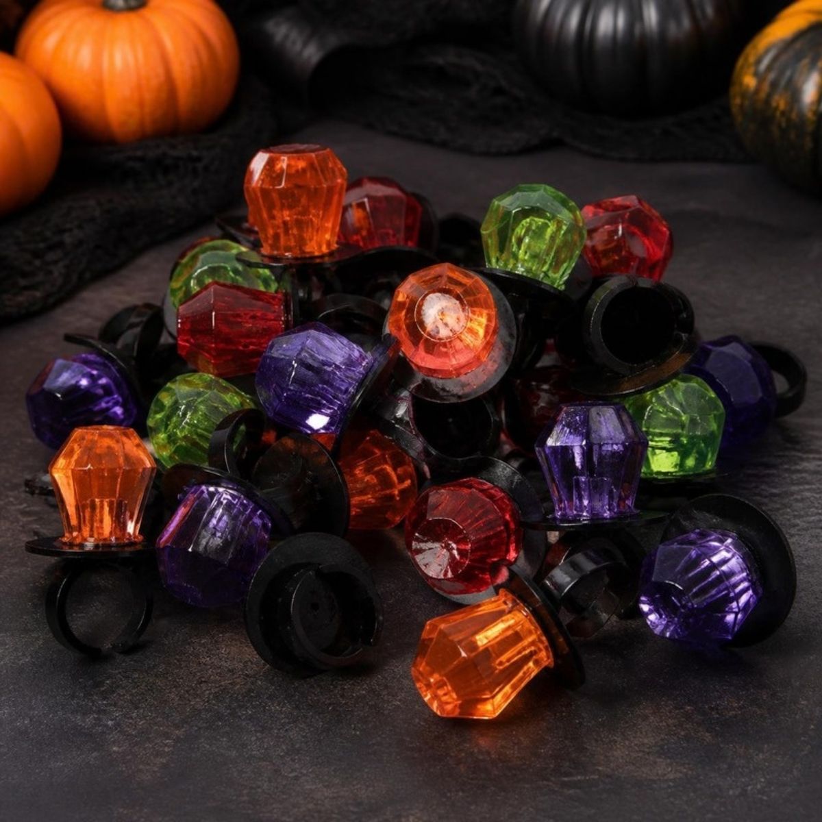 Pile of orange, purple, green and red ring lollipops