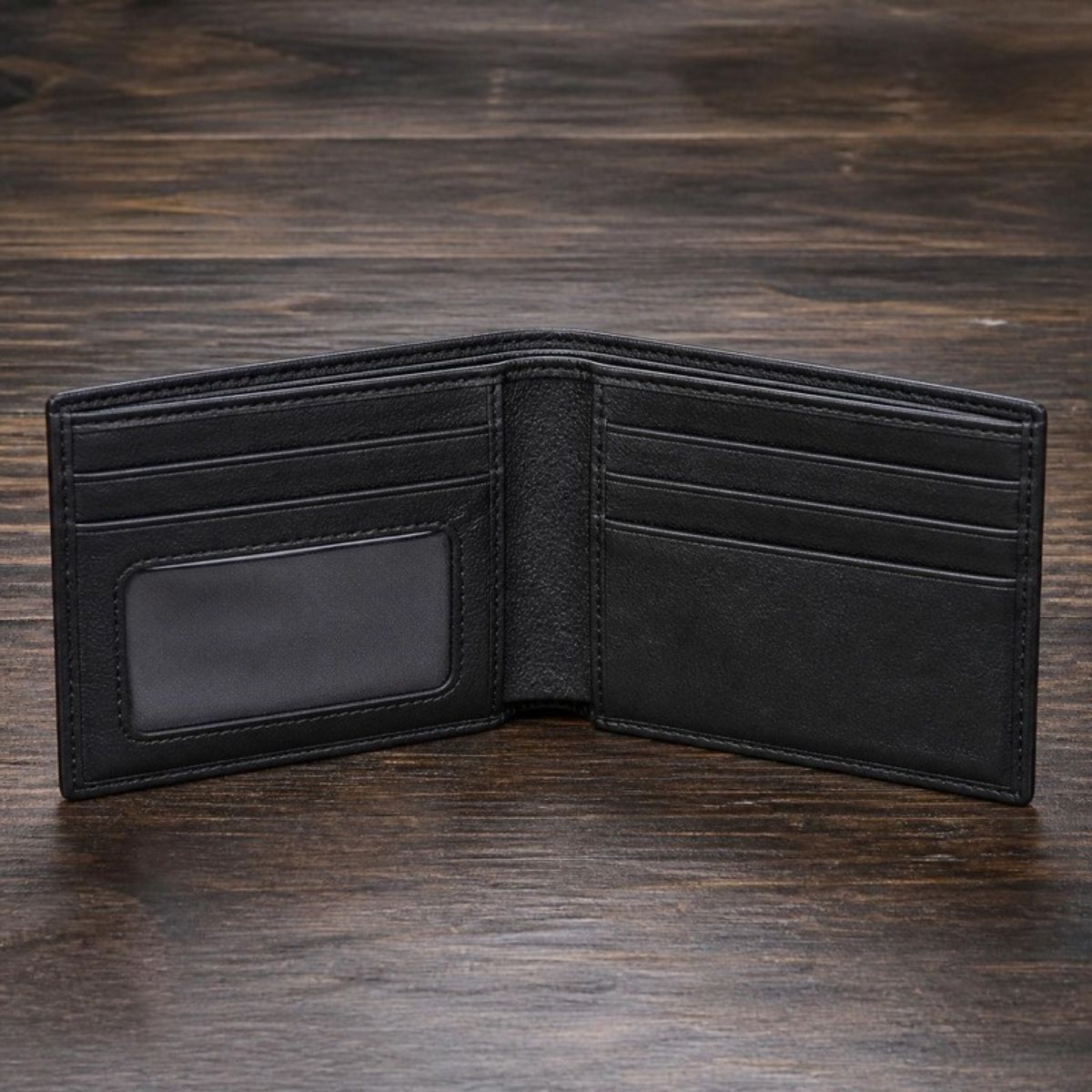 Black leather bifold wallet with an ID window