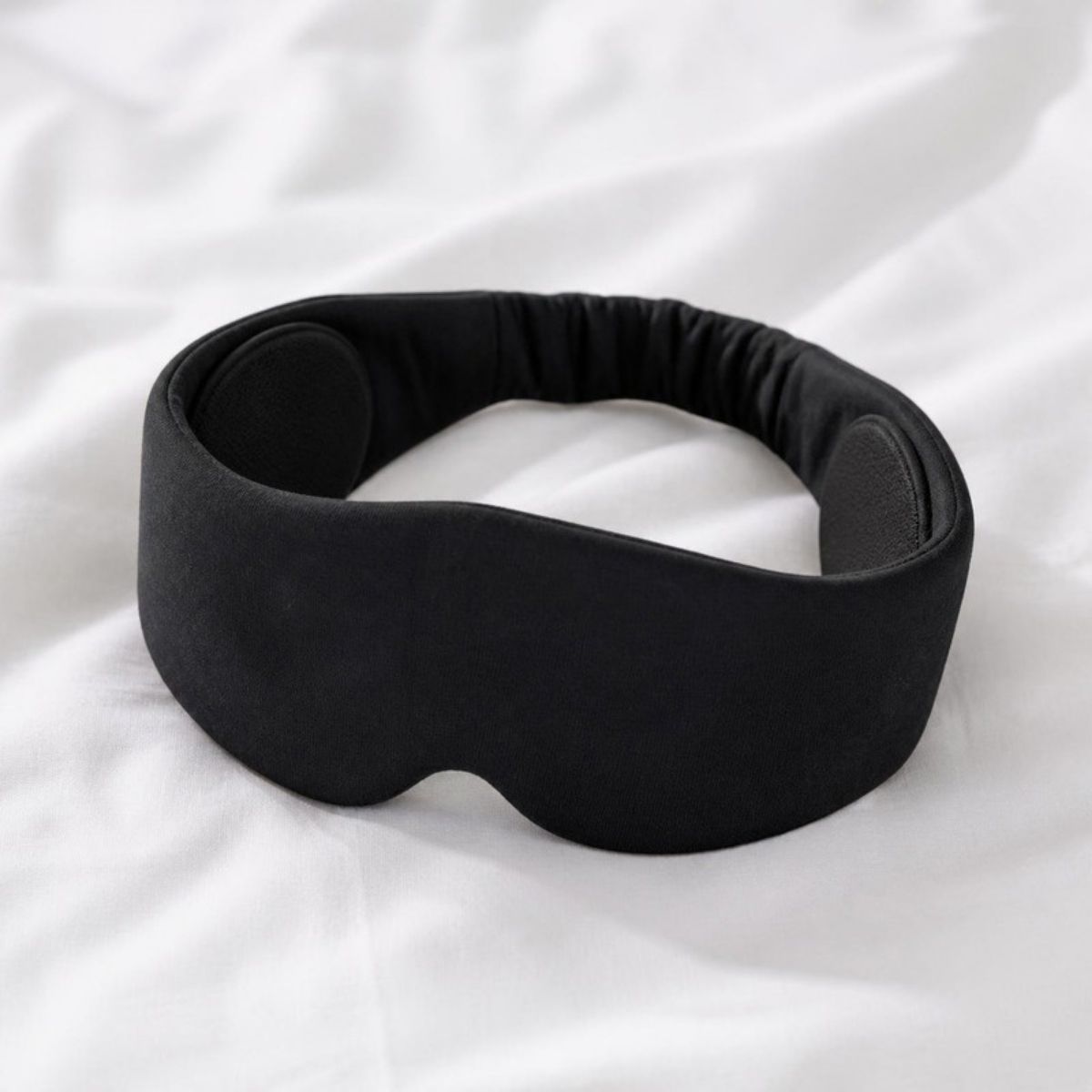 Black padded sleep mask with built-in headphones
