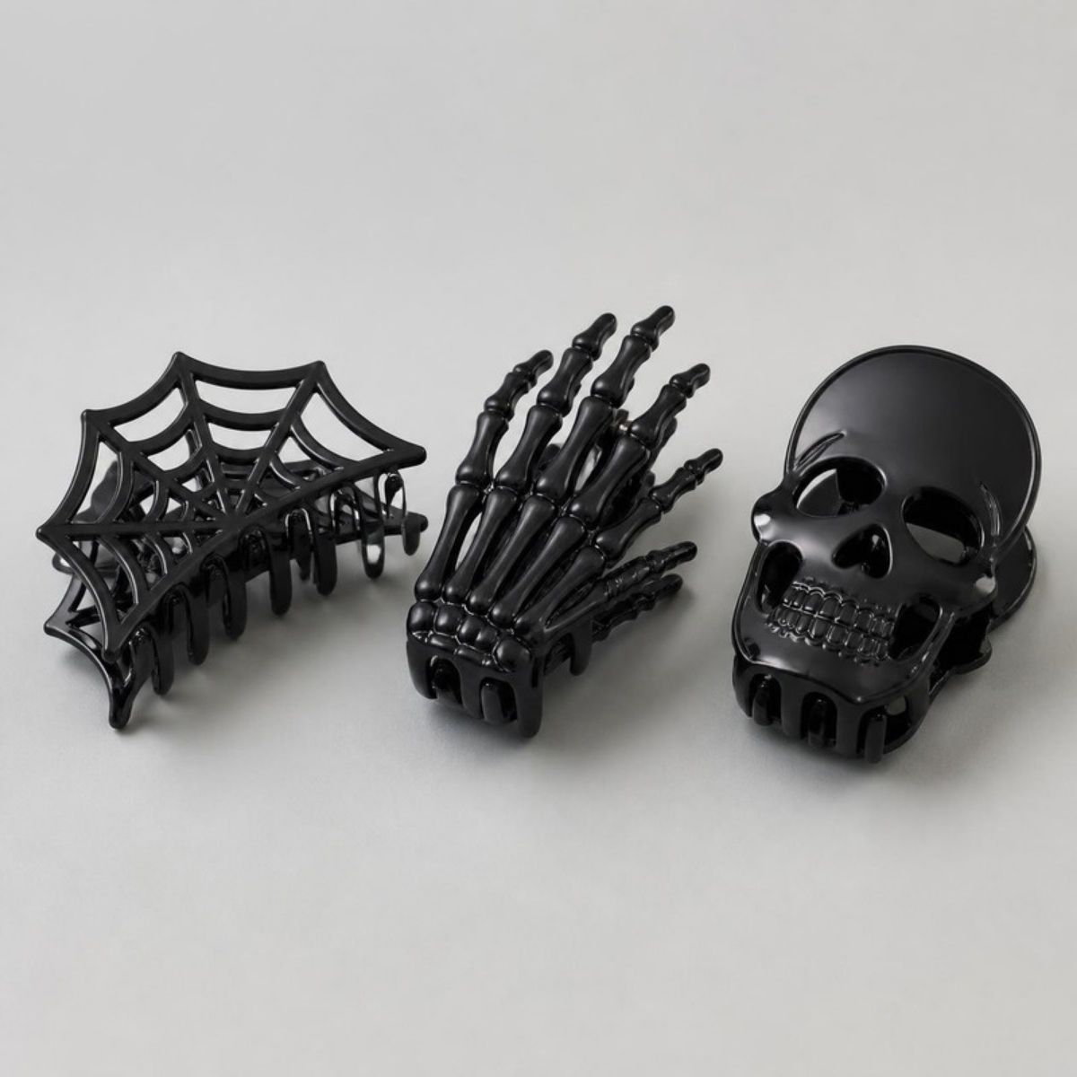 Black spider web, skeleton hand and skull hair claw clips