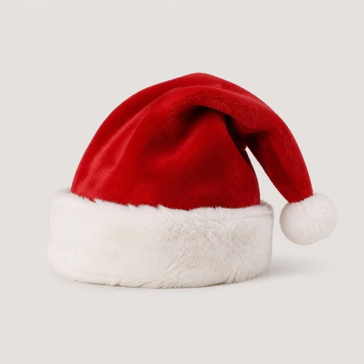 Red plush Santa hat with a white fur cuff and pom-pom